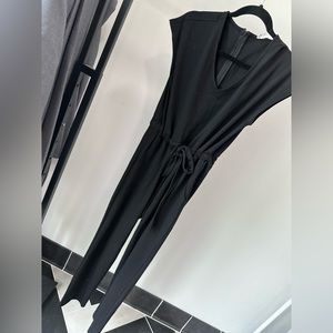 Size small boutique, bought black pocketed jumpsuit
